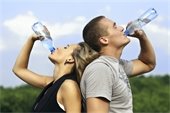 Picture of couple drinking water after a run 