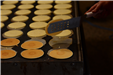Pancakes being cooked on a griddle