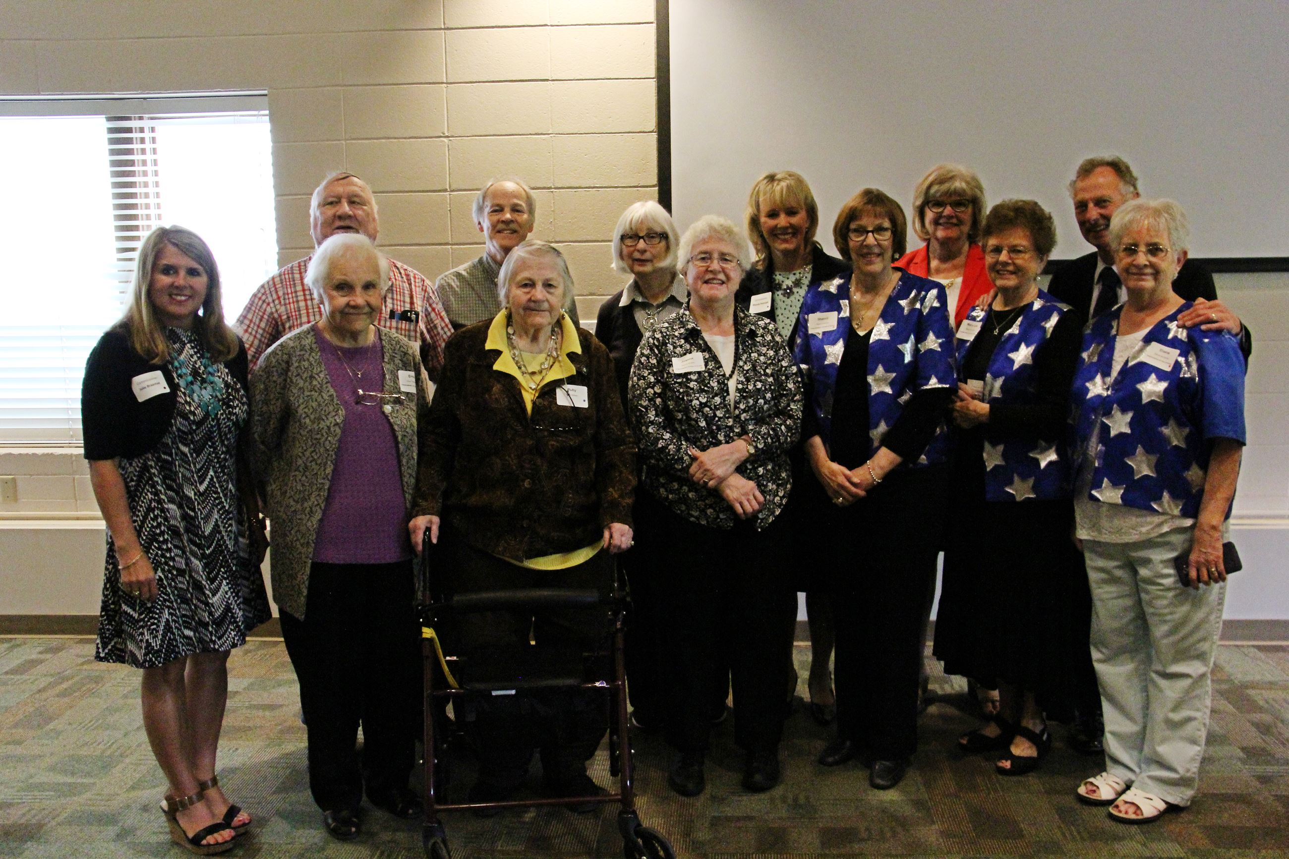 Commissioners stand with RSVP events guests