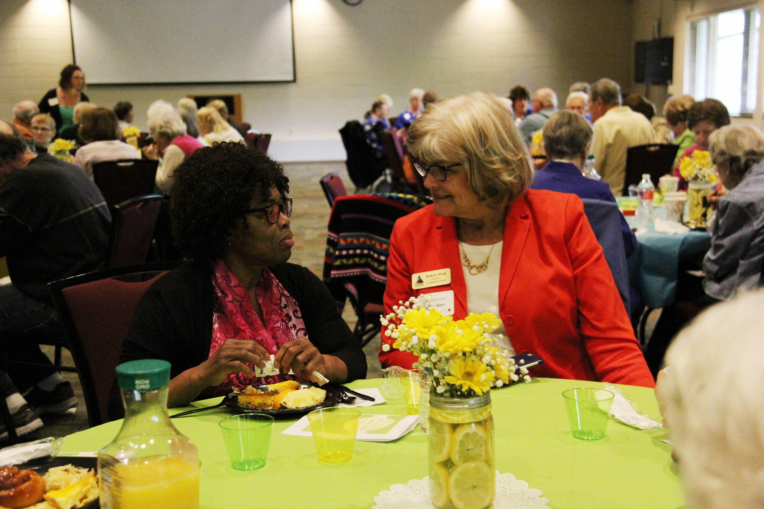 Commissioner Robyn West visits with RSVP event guest