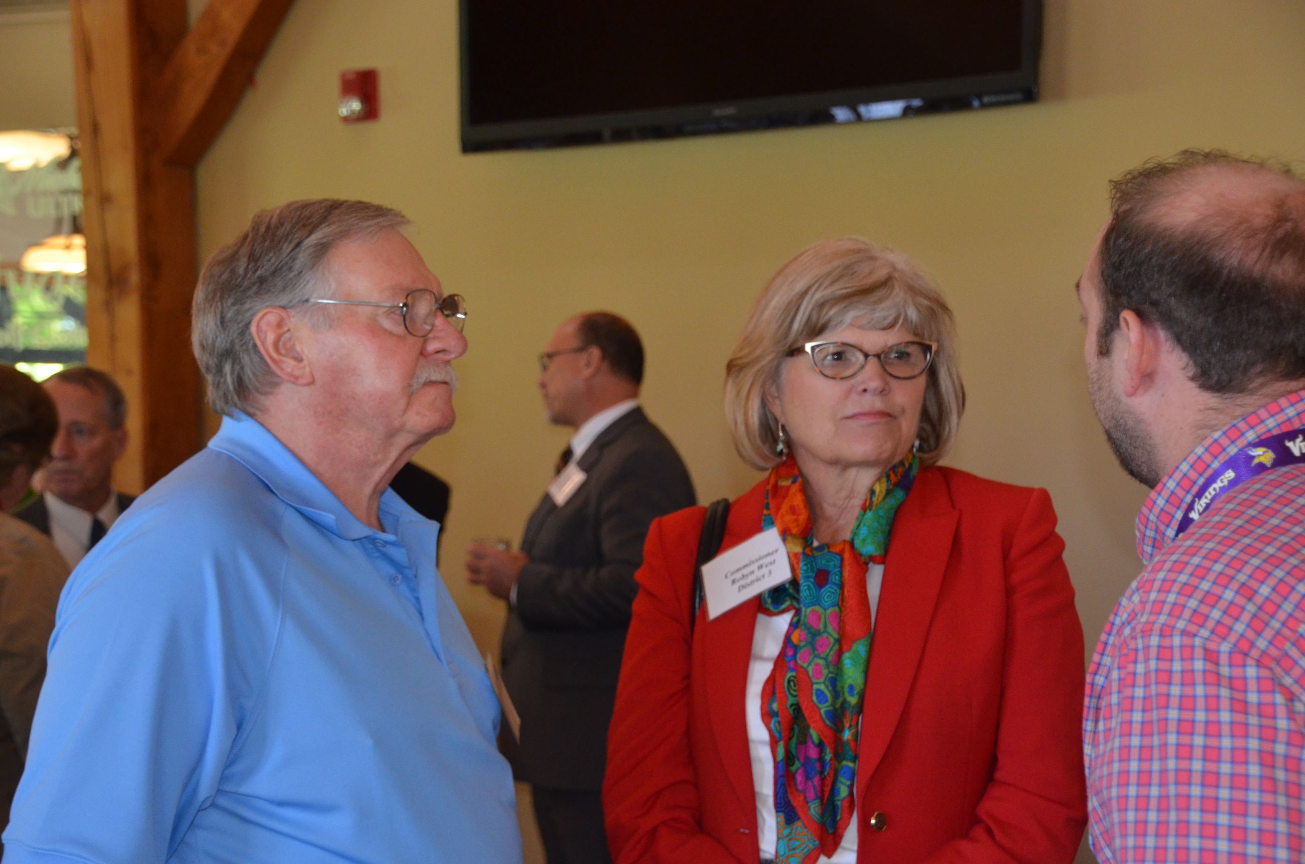 Commissioner West chatting