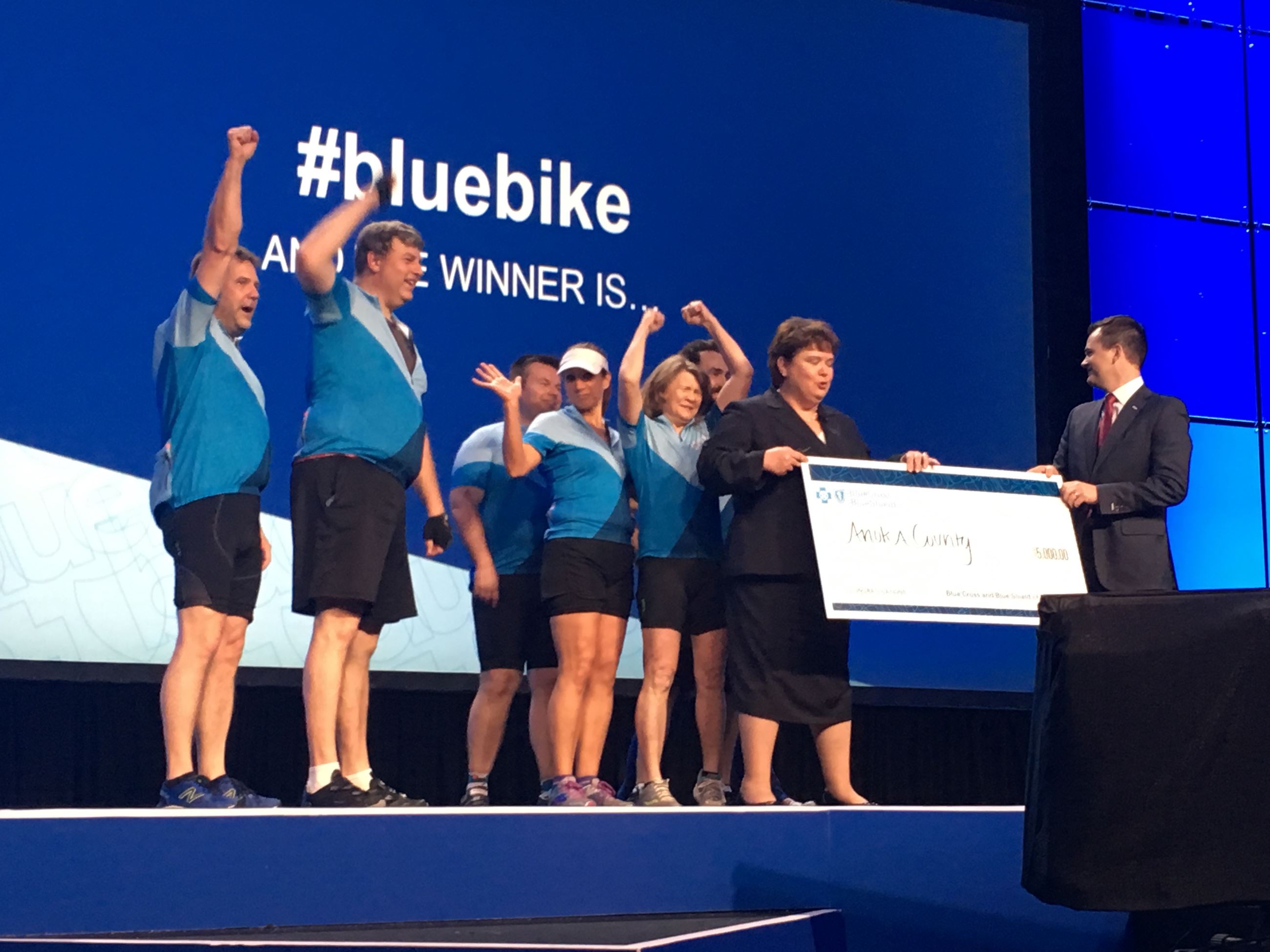 Blue Bike Challenge Team accepts check from Blue Cross Blue Shield