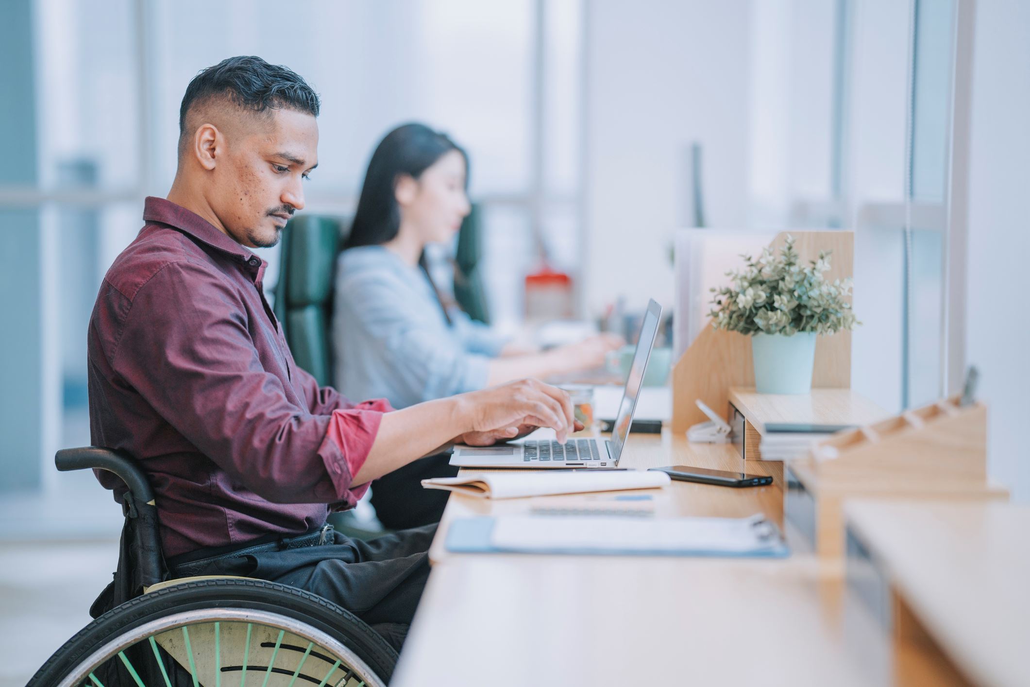 Man in wheelchair at computer