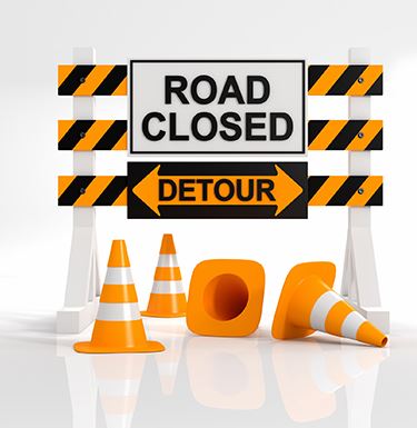 Road Closed Detour sign with traffic conees