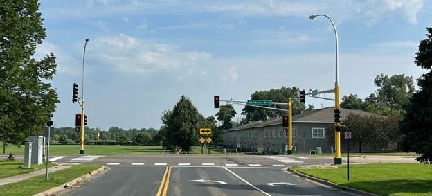 Image of Northdale Boulevard at Raven Street with stoplights.