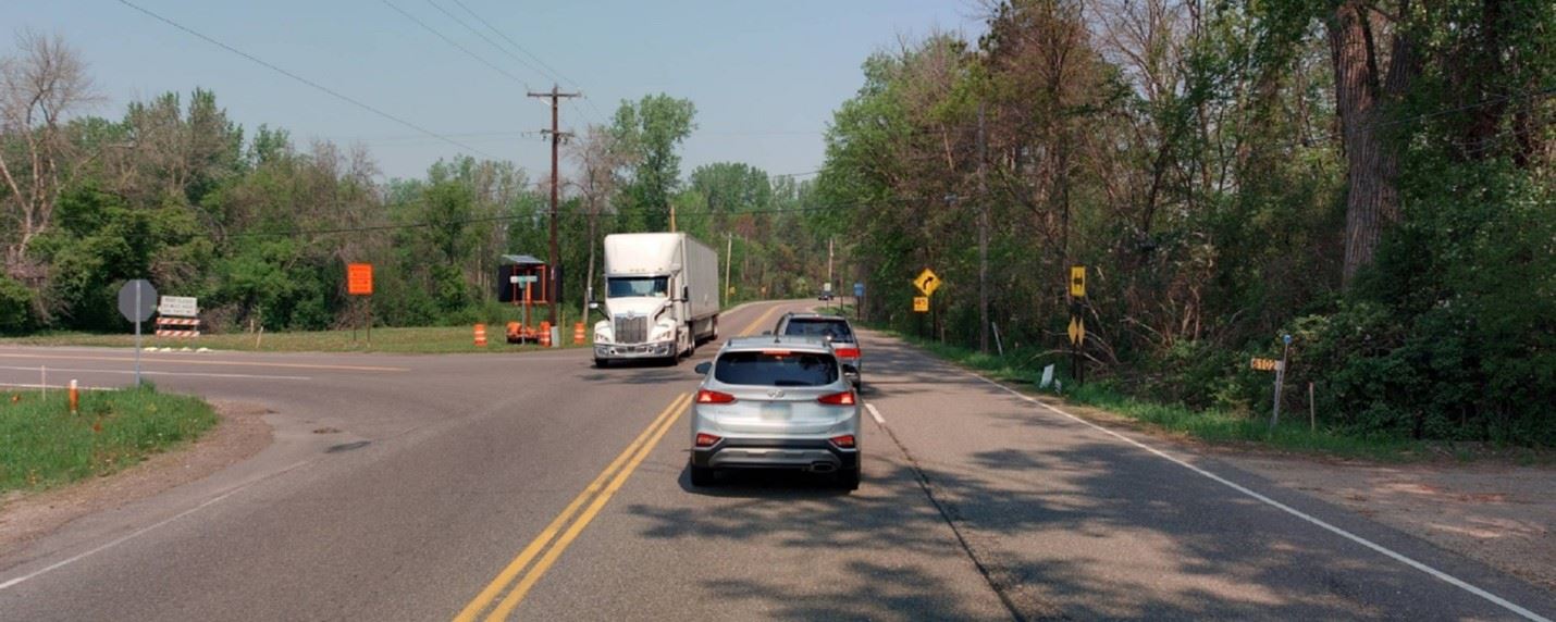 Image of Ash Street and Centerville Road with cars and a semi-truck on the roadway.